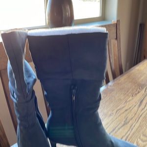 These a a brand new pair of heeled boots. They have never been worn.